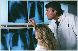 Doctor discussing x-ray with patient